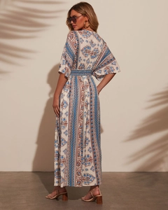 Detail of bohemian floral print on maxi dress featuring V-neck and ethnic pattern