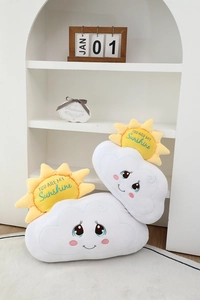 Close-up of soft sun and cloud plush pillow with You Are My Sunshine embroidery