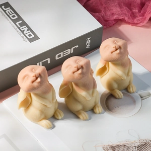 Three creative smiling rabbit figurines for Easter home decor in warm beige and pink tones