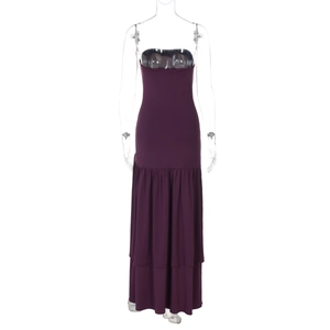 Detailed view of elegant purple strapless dress featuring layered ruffle hem and flowing fabric