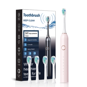 Pink sonic electric toothbrush with four DuPont replacement heads and smart timer