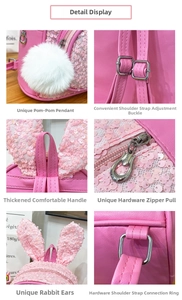 Detailed close-up of pink sequin backpack featuring cute bunny ears and soft pompom charm