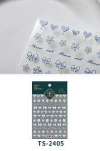 Detail of 3D embossed light blue nail stickers featuring floral and heart designs