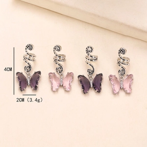 Detailed view of pink and purple butterfly hair charms with spiral alloy clips and crystals