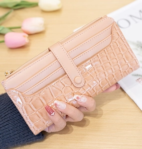 Detailed view of stone pattern long wallet featuring multiple card slots and secure zip