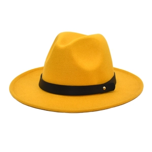 Close-up of ginger yellow wool fedora hat featuring a black belt with gold stud detail