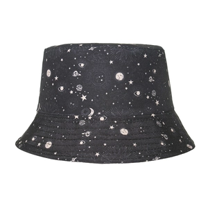 Detailed close-up of heavy canvas texture and white celestial patterns on black bucket hat