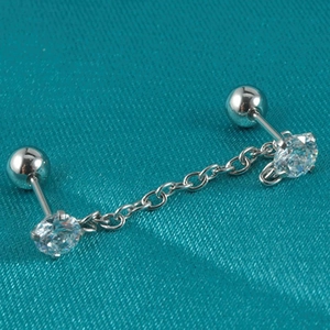 Macro shot of silver stainless steel double stud chain earring with zircon stones