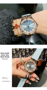 Detail of rose gold rhinestone watch with sky blue strap on wrist with jewelry