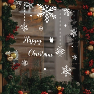 White Christmas snowflake window stickers with Happy Christmas text on glass window