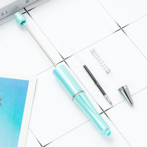 DIY beadable ballpoint pen kit in aurora mint green with metallic components and refills