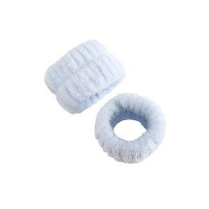 Detailed close-up of light blue ribbed coral fleece headbands with soft plush texture