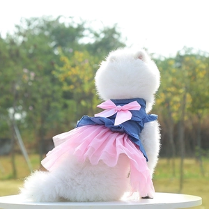 Detail of pet denim dress with pink mesh skirt and elegant satin bow for cats and small dogs