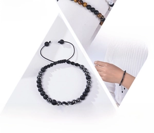 Detail of Morse code bracelet featuring matte black stones and adjustable woven cord