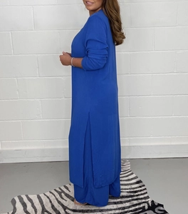 Detail view of royal blue long sleeve side slit tunic and wide-leg trousers set