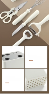 Close-up of kitchen tool set organizer with tool slots and bottom drainage system