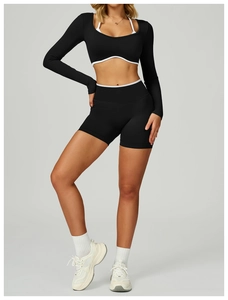 Side view of seamless two-piece yoga crop top and high-waist shorts set for fitness