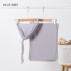 Detail of light grey modal inner cap and chiffon scarf set hanging on a white rack