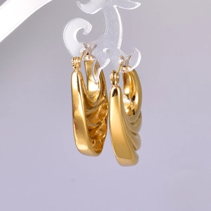 Polished 18K gold stainless steel chunky hoop earrings with textured wave design