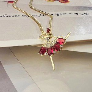 Exquisite 18K gold plated necklace featuring a ballet girl pendant with red gemstones