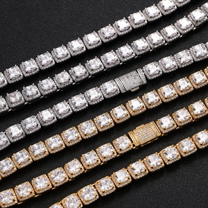Detail view of silver and gold tennis chains with square cut stones and box clasps