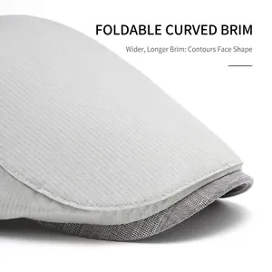Light gray newsboy cap featuring wide foldable brim and textured twill fabric design
