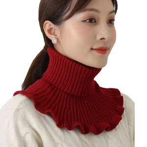 Women's red knitted neck warmer with ruffle edges shown on model in studio setting