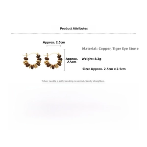 Detailed view of gold earrings with tiger eye stone and silver pins showing dimensions