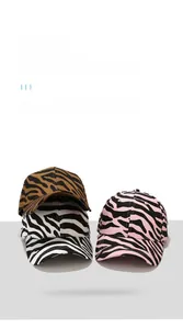 Detailed view of fashionable baseball caps featuring zebra and tiger prints in three colors