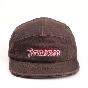 Detail of brown canvas camper cap featuring red HAVE A NICE GAME and Tennessee embroidery
