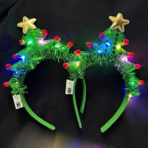 LED Christmas headband set with glowing green trees, gold stars and red pompoms