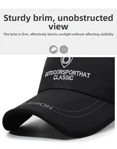 Detail of black breathable mesh baseball cap with white outdoor embroidery and curved brim