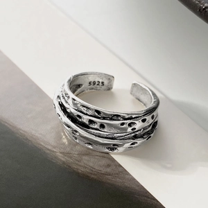 Macro shot of S925 engraved hallmark on vintage textured silver wrap ring