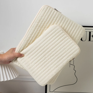 Quilted cream laptop sleeve set with vertical stripes and shockproof nylon material
