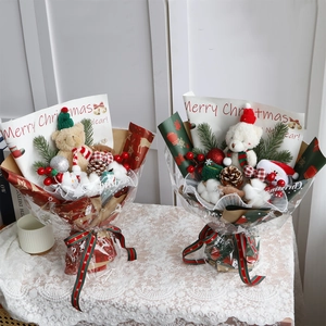 Detailed Christmas teddy bear bouquet with pine cones and red berries on lace cloth