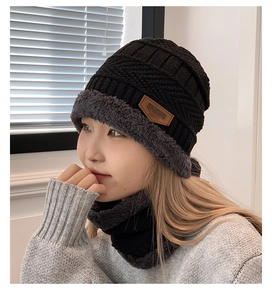 Close-up of winter knit hat and neck warmer set with thick grey fleece lining