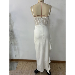 Close-up of white lace bodice with butterfly appliques and sequin details on the dress