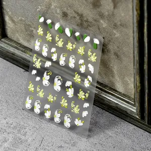 3D embossed daisy flower nail art stickers with elegant yellow and white floral patterns