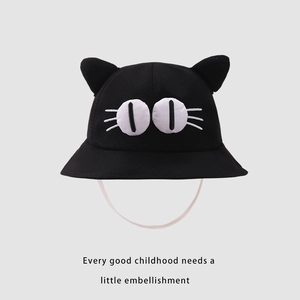 Close-up of black kids bucket hat featuring cute cat ears and 3D big eyes detail