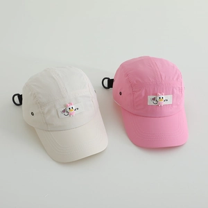Detail of kids baseball cap showing breathable holes and adjustable black buckle strap