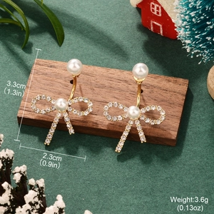 Elegant gold bow heart earrings with pearls and crystals measuring 3.3cm by 2.3cm