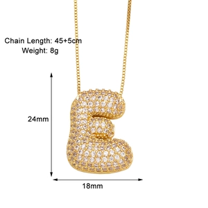 Detail view of gold letter E necklace with CZ stones and 45+5cm chain size specs