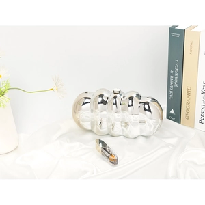 Chic silver wavy texture cloud clutch bag on white silk for a luxury lifestyle look