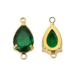 Close-up of two golden teardrop pendants featuring green zircon stones for DIY jewelry