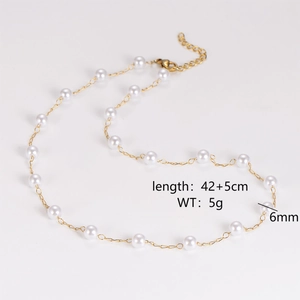 Detail view of a vintage stainless steel necklace with irregular white pearls and sizing specs