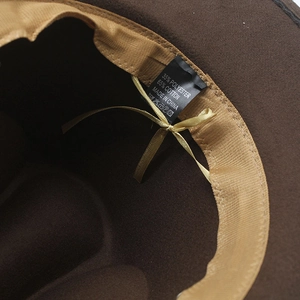 Detailed interior of coffee wool fedora showing sweatband and 65% cotton care label