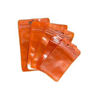 Premium orange resealable storage bags with hanging holes in multiple sizes on white background