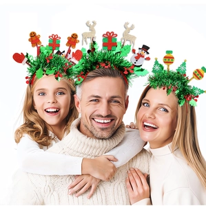 Happy family wearing festive Christmas headbands with tinsel and reindeer decorations
