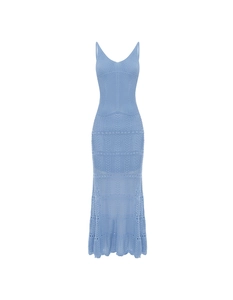 Detail of light blue hollow crochet knit fabric with wave texture on summer beach dress