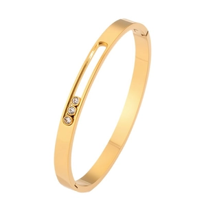 Gold plated titanium steel bangle featuring sliding three-diamond groove design